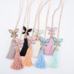 Long Gold Necklace Featuring Rhinestone Butterfly Tassel Pendant